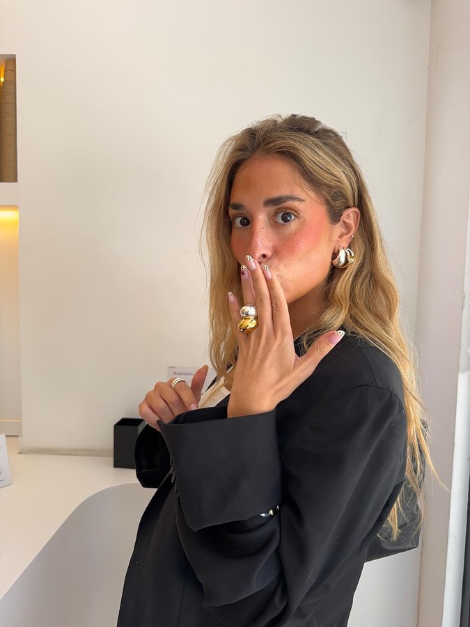 Instagram post by @aresaixala for TOUS. Caption reads: Morning coffee wearing Manifesto <3 
@tousjewelry....