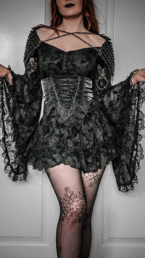 Instagram post by @thescarletthuntress for FANTASMAGORIA. Caption reads: [...] black dress 🖤 

Outfit #gifted by....