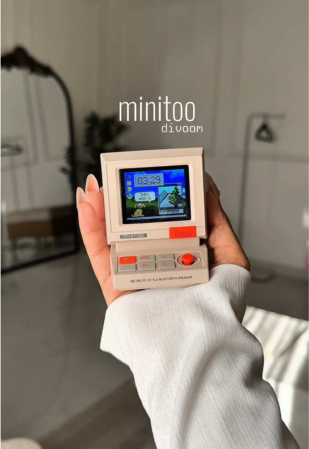 TikTok post by @regisploen for Divoom. Caption reads: [...] computer from the 90s! #minitoospeaker....