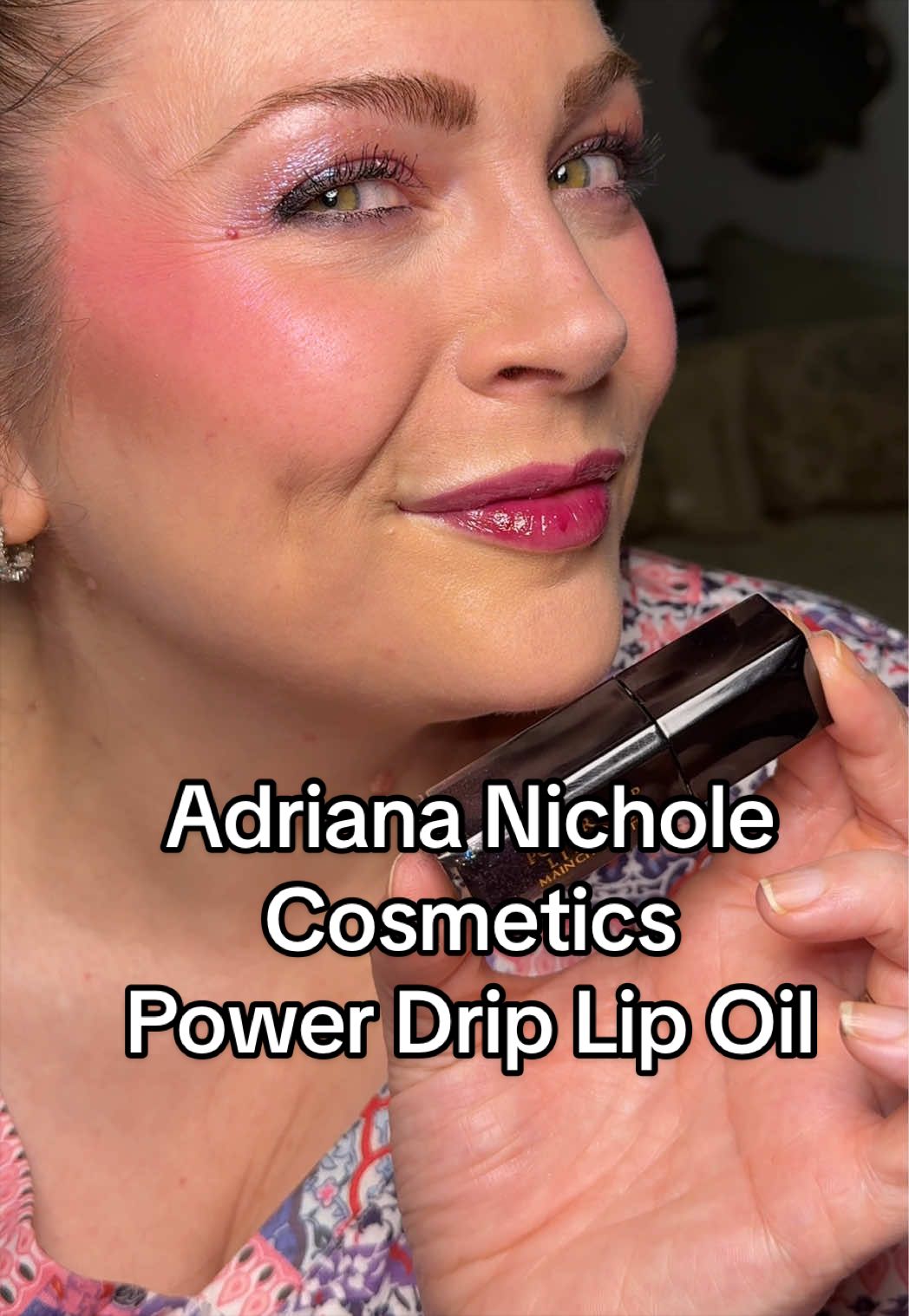 TikTok post by an influencer for Adriana Nichole Cosmetics. Caption reads: [...] lip oils from @Adriana Nichole Cosmetics 😍....