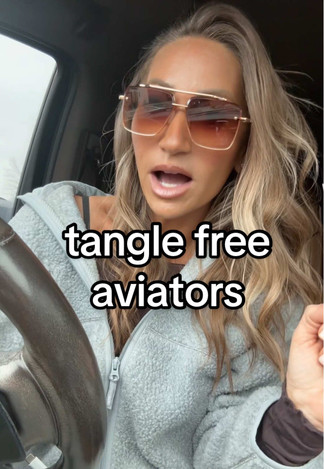 TikTok post by @sarahhill920 for TopFoxx. Caption reads: @TopFoxx #aviators #tanglefreeaviators #sunnies .