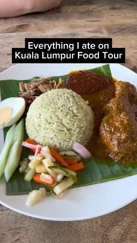 Instagram post by @authentic_traveling for AirAsia. Caption reads: [...] for food lovers! 🇲🇾 Thank you @flyairasia....