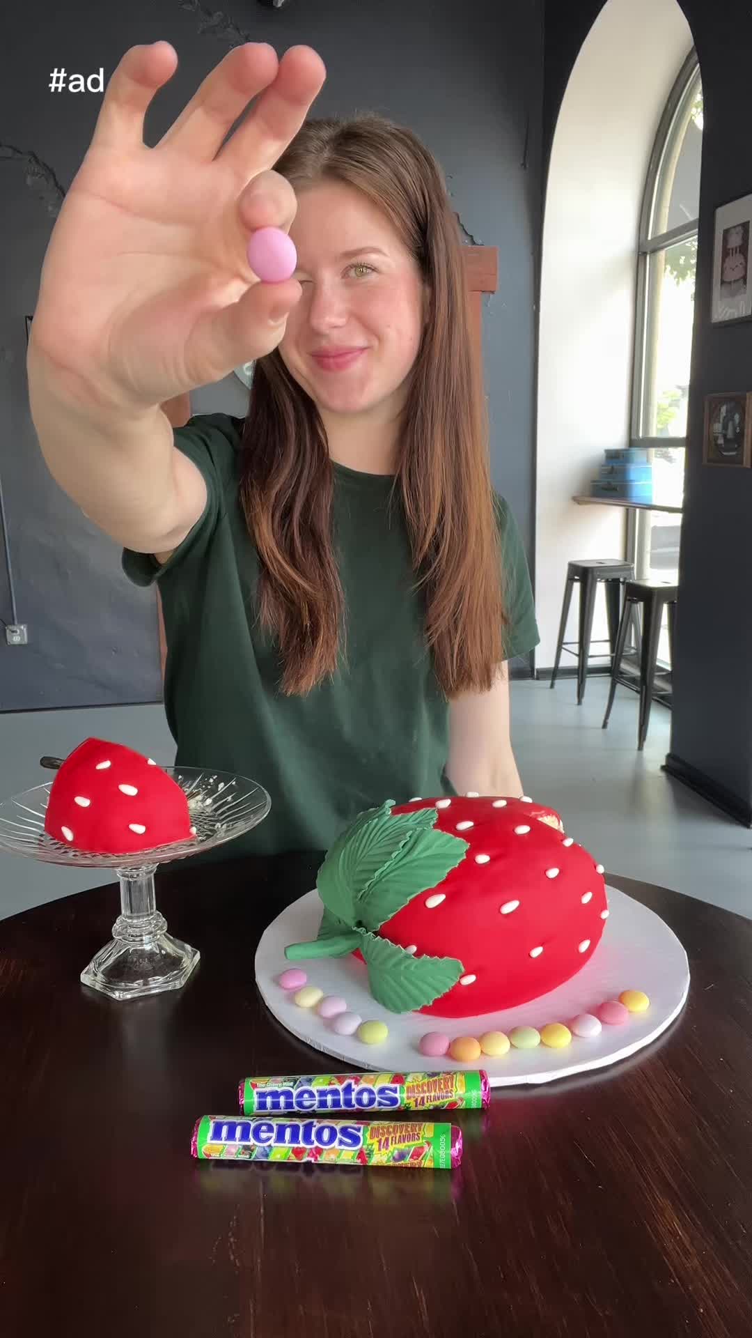 TikTok post by @whisk.chick for Mentos. Caption reads: This adorable cake is inspired by the strawberry....