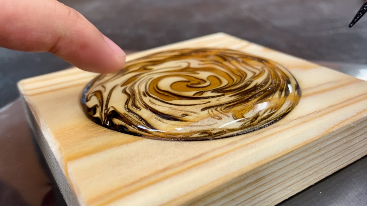 YouTube post by @kurahito for LaserPecker. Caption reads: I want to evolve suminagashi.