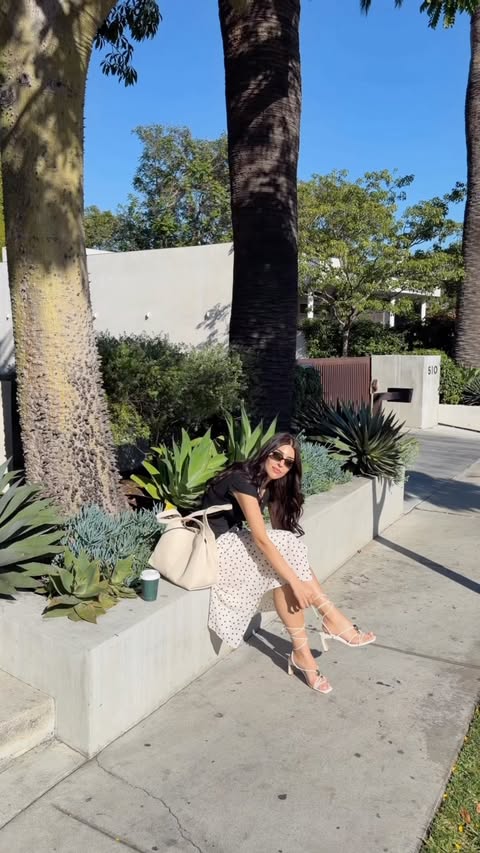 Instagram post by @im._.soniamahmoudieh for DSW Designer Shoe Warehouse. Caption reads: Keeping it classic in white 🤍✨ @dsw #dsw #ad.