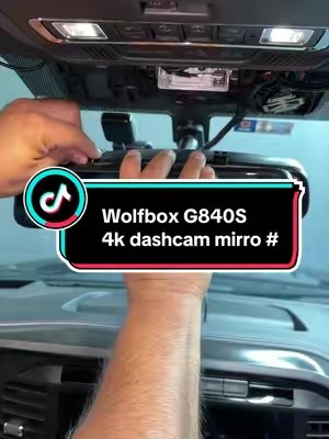 TikTok post by @elcompamartinr for WolfBox. Caption reads: [...] a dash cam! #automotriz #carupgrade #wolfbox....