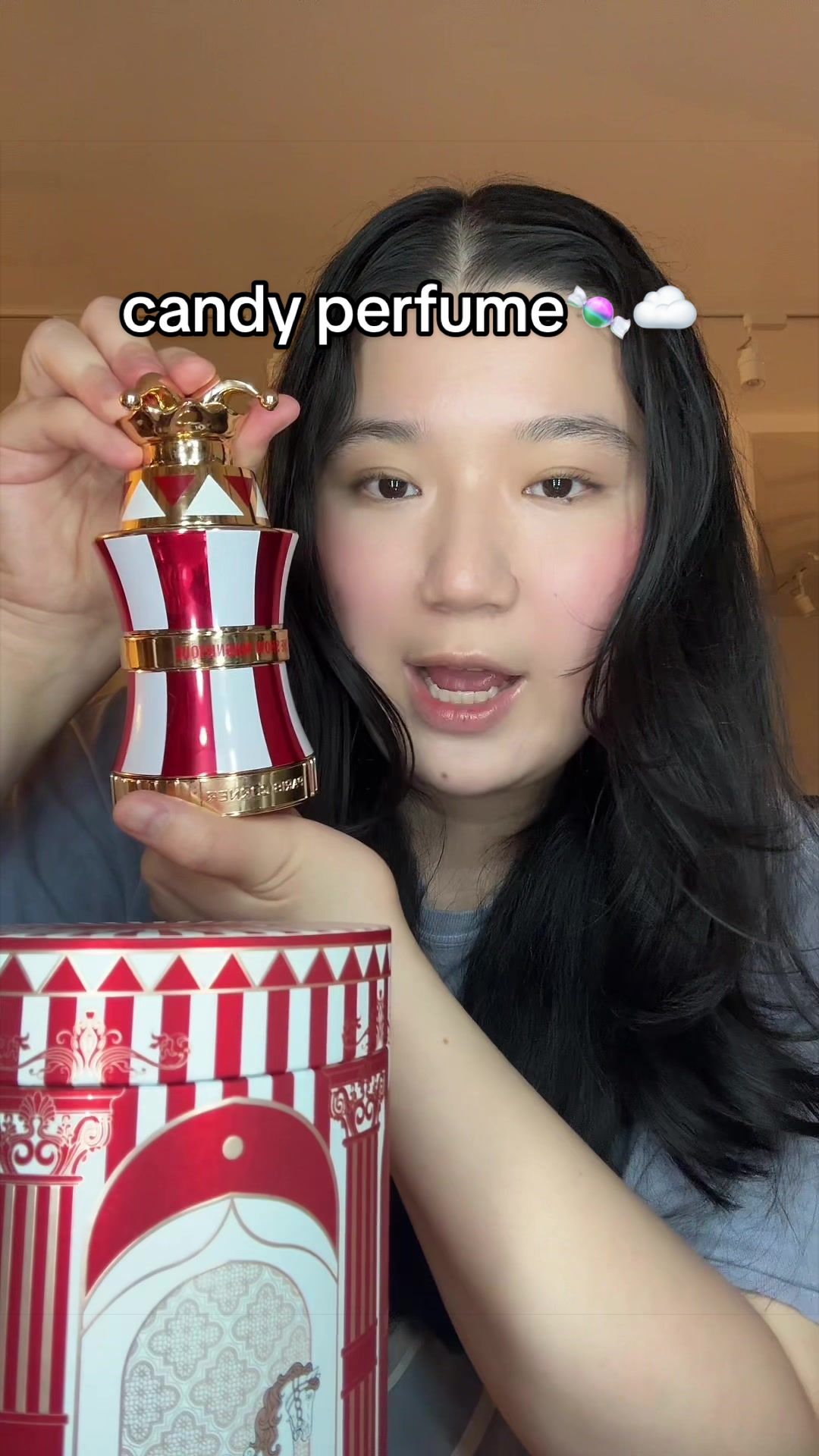 TikTok post by @loverlucylol for Intense Oud. Caption reads: [...] candy cloud in perfume form ✨ @Intense Oud....