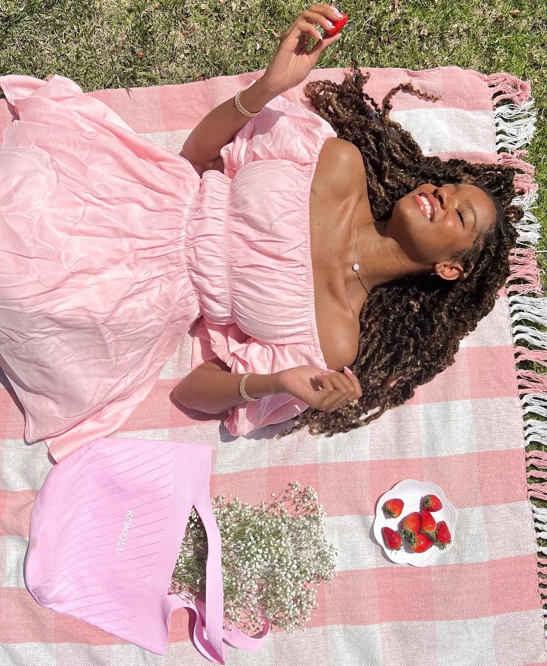 Instagram post by @chazlyn.yvonne for InfluenceHer Collective. Caption reads: Spring daydreaming ☁️🍓🎀
#ad As earth month comes....