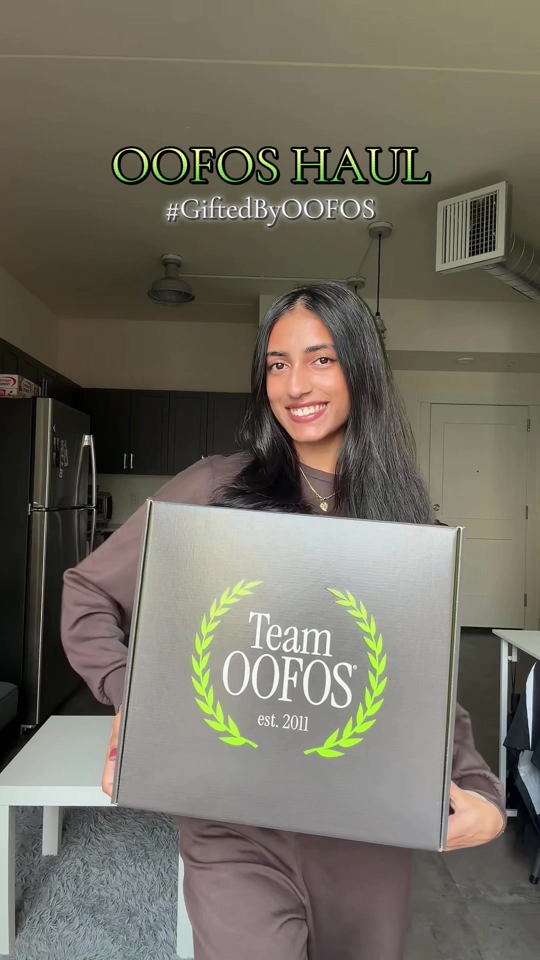 TikTok post by @riyaaa.patelll for Her Campus. Caption reads: [...] #GiftedByOOFOS #HCAthleticClub @OOFOS....