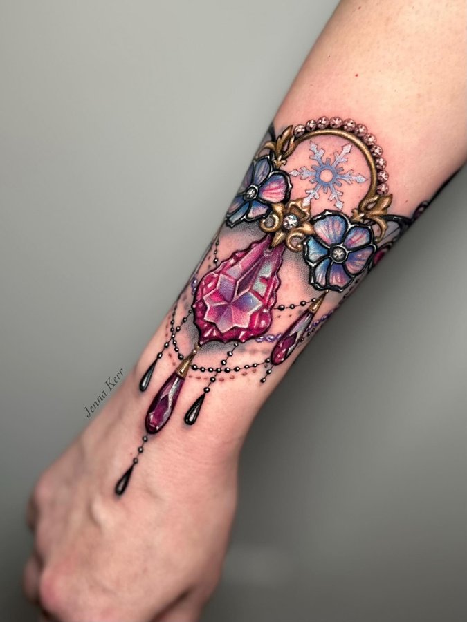 Instagram post by @jennakerrtattoo for Fkirons. Caption reads: Swipe to see different angles of this jewelled....