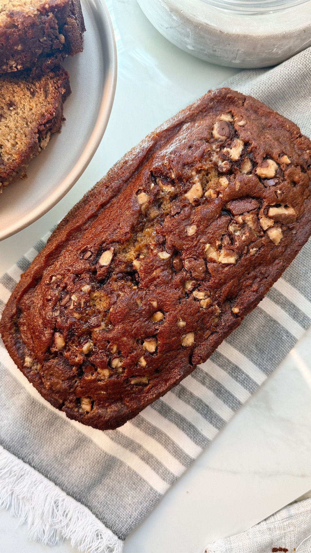 Instagram post by @ejscookin for Taste of Home. Caption reads: @Ejscookin's bourbon banana bread is rich, moist,....