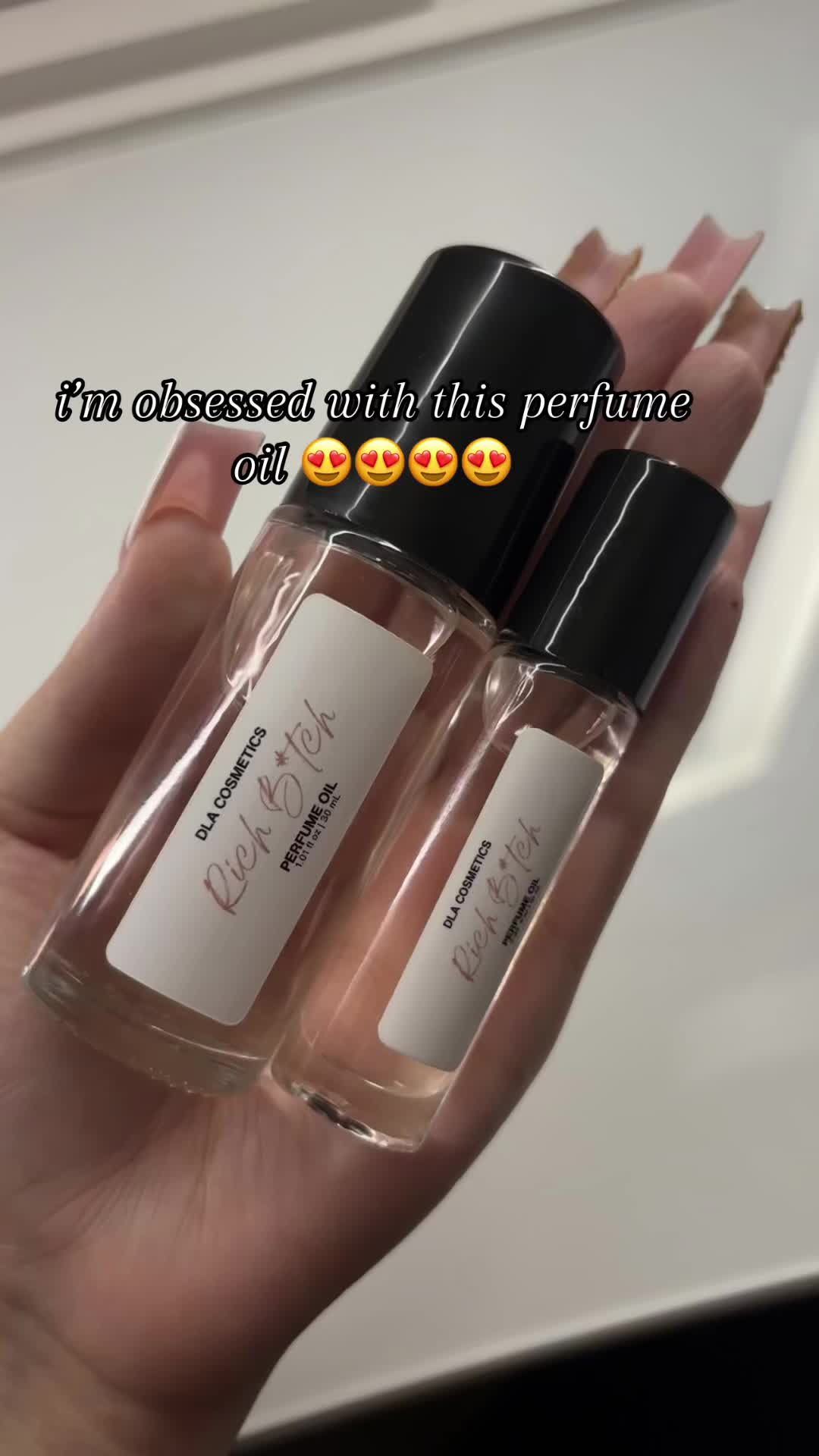 TikTok post by @user041823222 for DLA COSMETICS. Caption reads: @DLA COSMETICS #dlacosmetics #dla #perfumeoil....