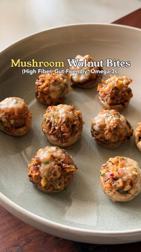 Instagram post by @auraartofhealthyliving for California Walnuts. Caption reads: [...] For these stuffed mushroom bites, California....