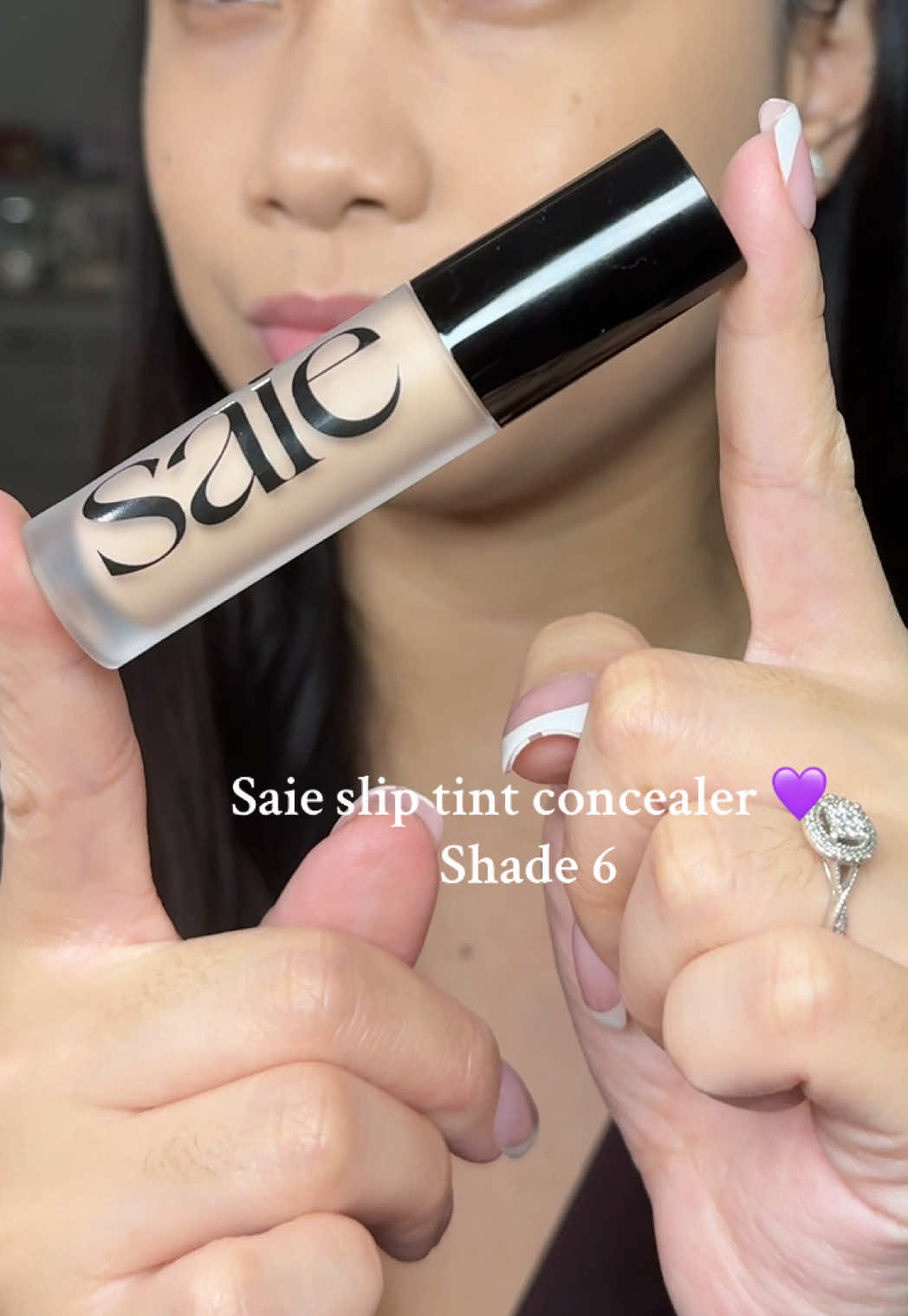 TikTok post by @anjane.xo for Saie hello. Caption reads: @Saie Slip Tint Radiant All-Over Concealer shade....