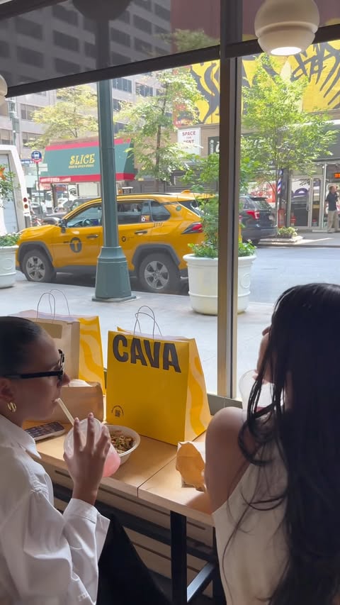Instagram post by @drewtownsel for CAVA. Caption reads: The best lunch breaks are with your BFFs @cava....