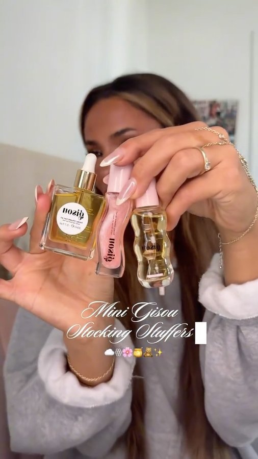Instagram post by @estellelebourgeois_ for Gisou. Caption reads: perfect stocking stuffer idea ꙮ🌸🍯❀ @gisou....