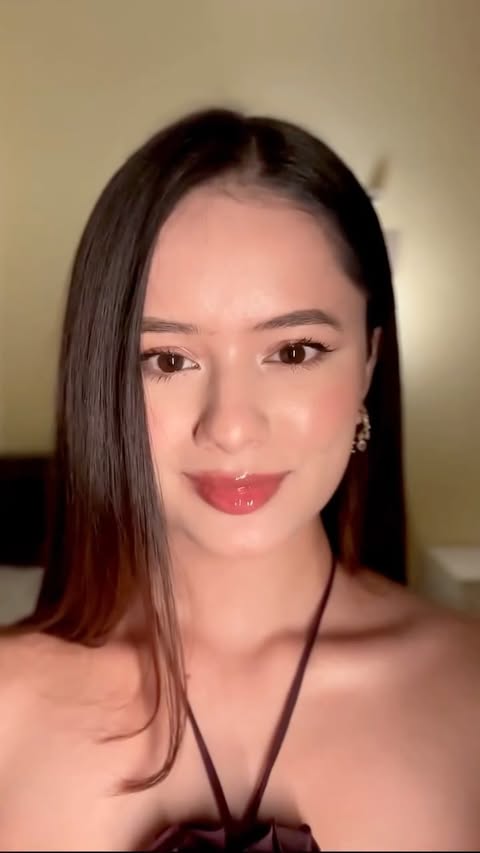 Instagram post by @ana_tamang_ for Revlon. Caption reads: [...] NYE look isn’t complete without a swipe of....