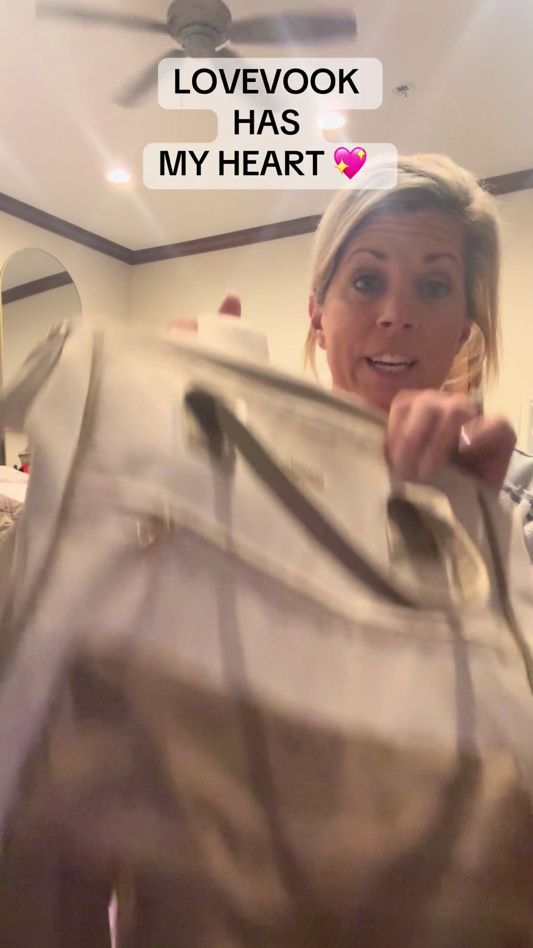 TikTok post by @lauraleigh25 for Lovevook. Caption reads: @Lovevook Bags you have my heart!!!💖 Seriously,....