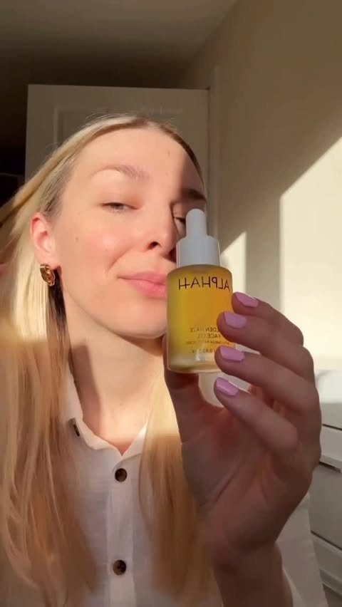 Instagram post by @dreammerin for ALPHA-H. Caption reads: Golden Haze Face Oil from @alphahskincare , a....
