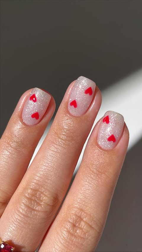 Instagram post by @simlynail for Nails.INC. Caption reads: cute hearts nail art inspo♥️✨ using @nailsinc gel....