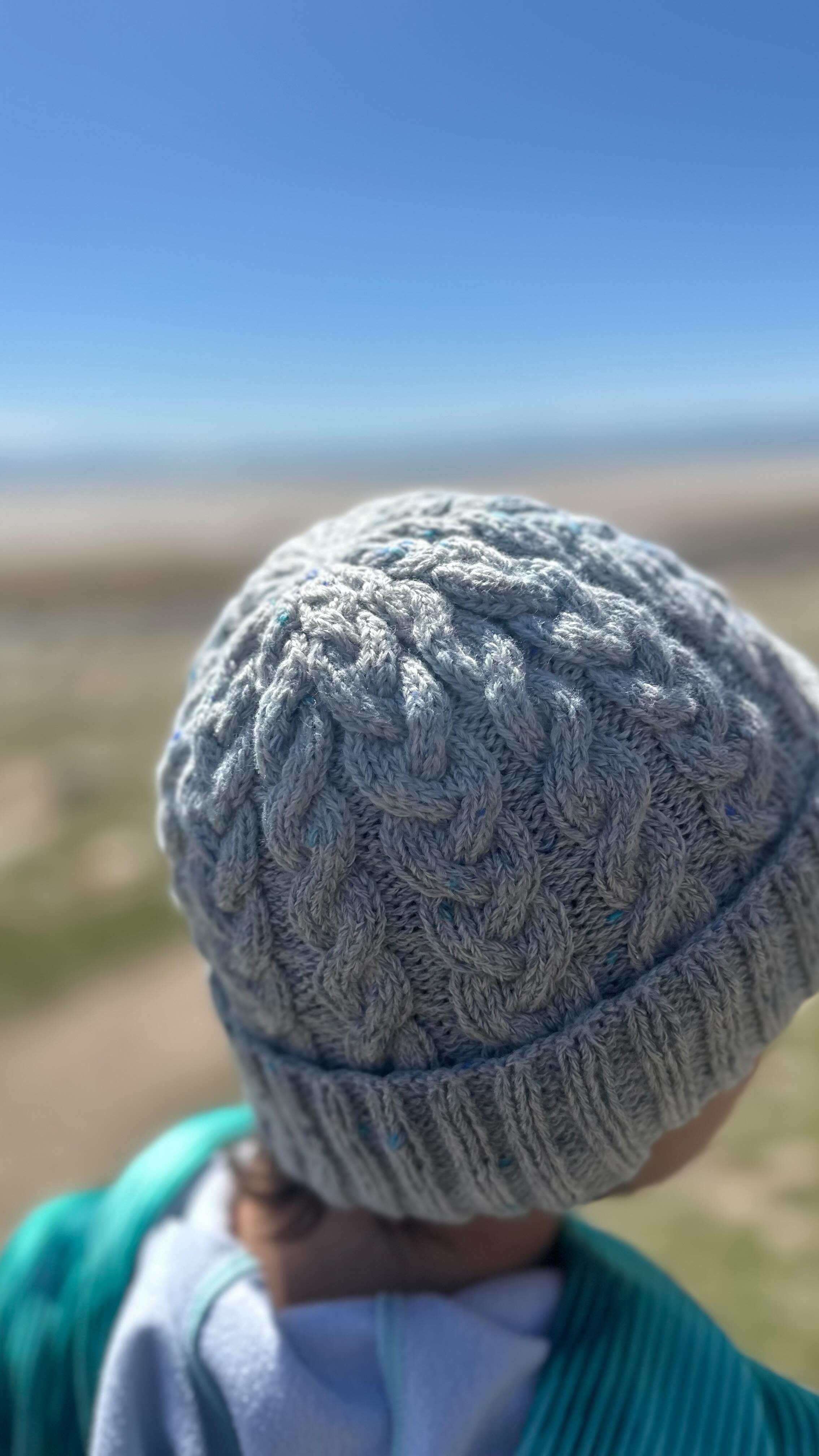 Instagram post by @celine.knits for Universal Yarn. Caption reads: Let’s knit the #TrueClassicHat in Rico Designs....