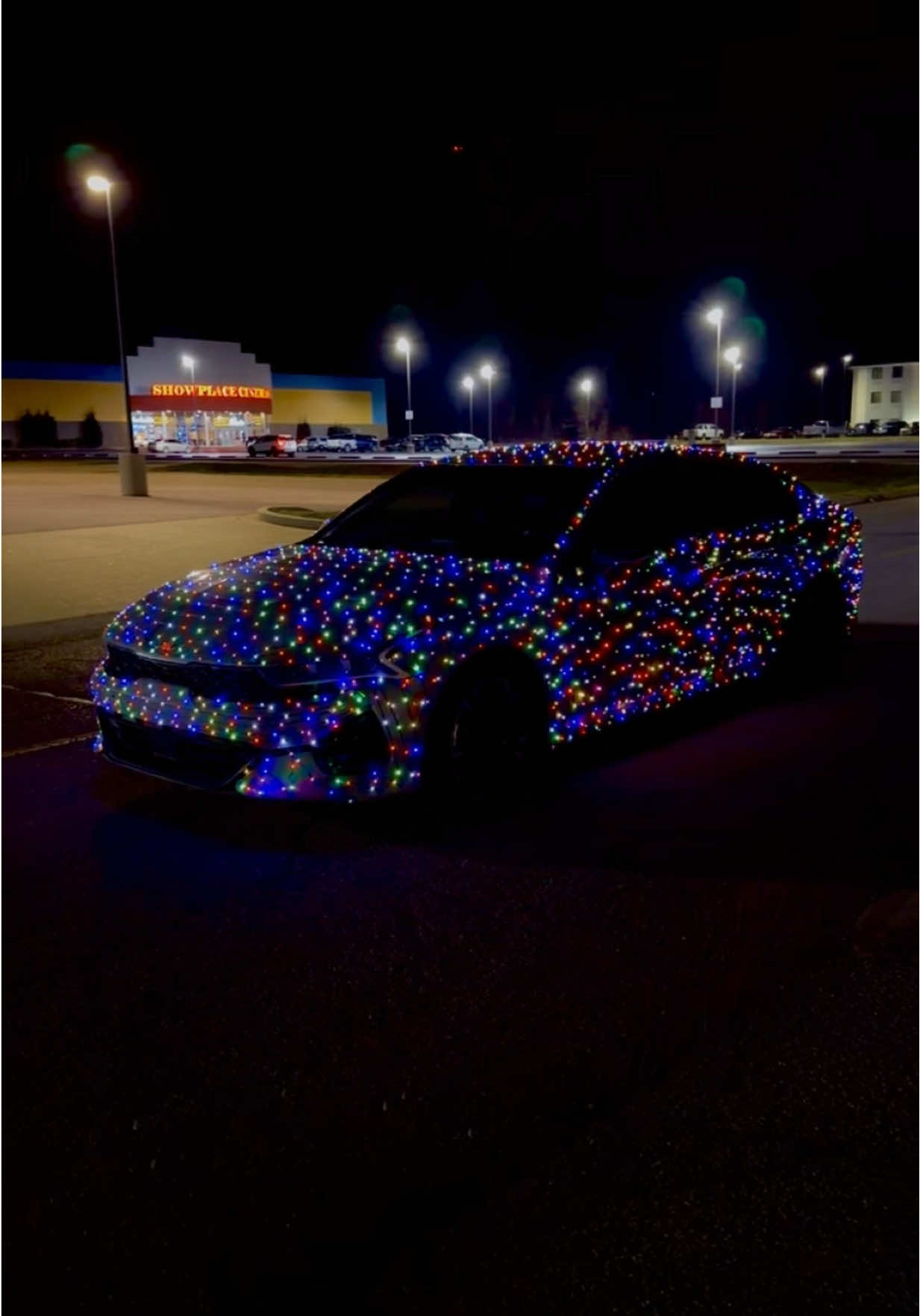 TikTok post by @simply_bbrooke for Kia. Caption reads: [...] your town with the Christmas lights car!....