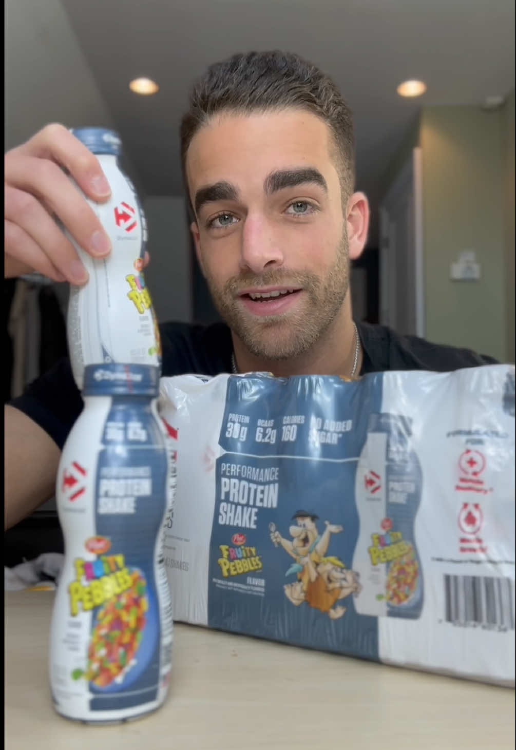 TikTok post by @maxandsnax for Dymatize. Caption reads: [...] Fruity Pebbles protein shake from @Dymatize....