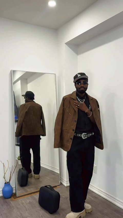 Instagram post by @riche.becker for Hoooyi. Caption reads: Woke up feeling myself 📸 Jacket from....