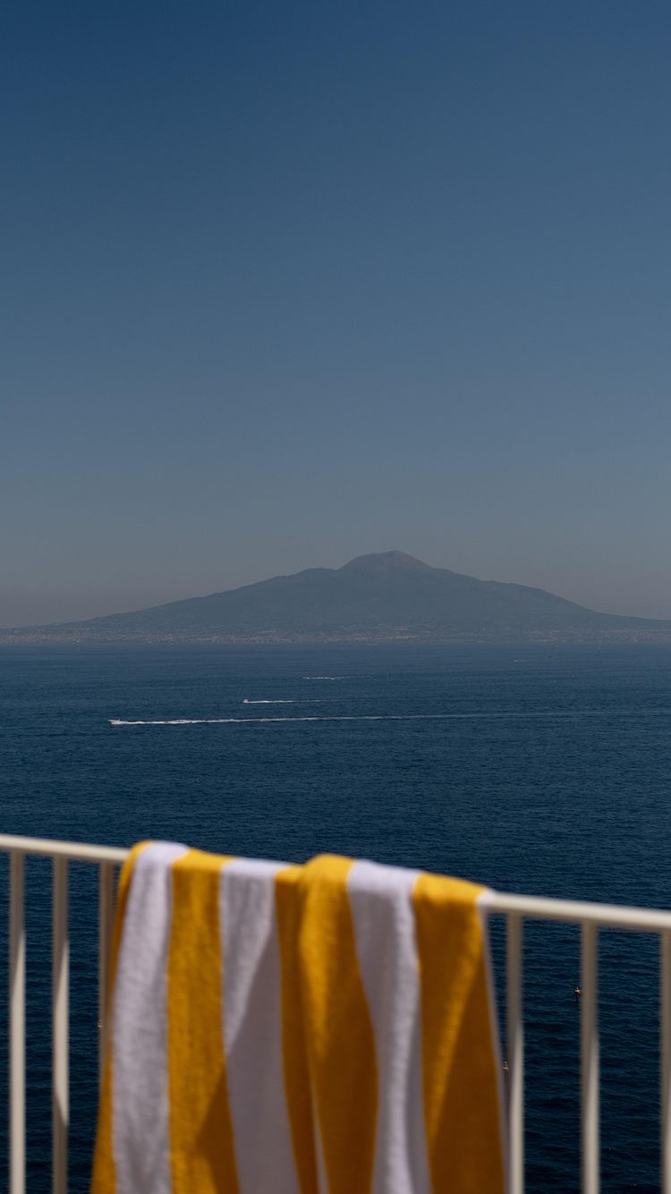 Instagram post by @_lagiuditta for Dalfilo. Caption reads: Never-ending summer days by the sea with....