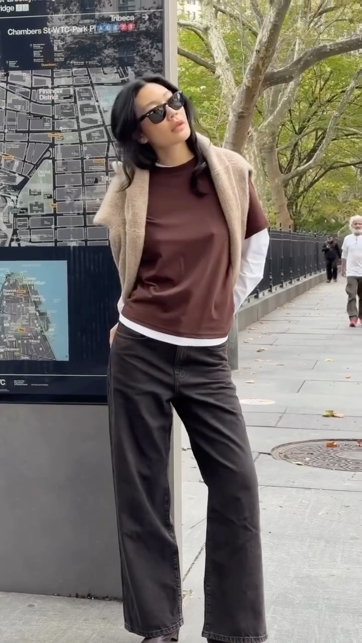 Instagram post by @laurajung for Shopbop. Caption reads: The fun thing about styling denim in the fall is....