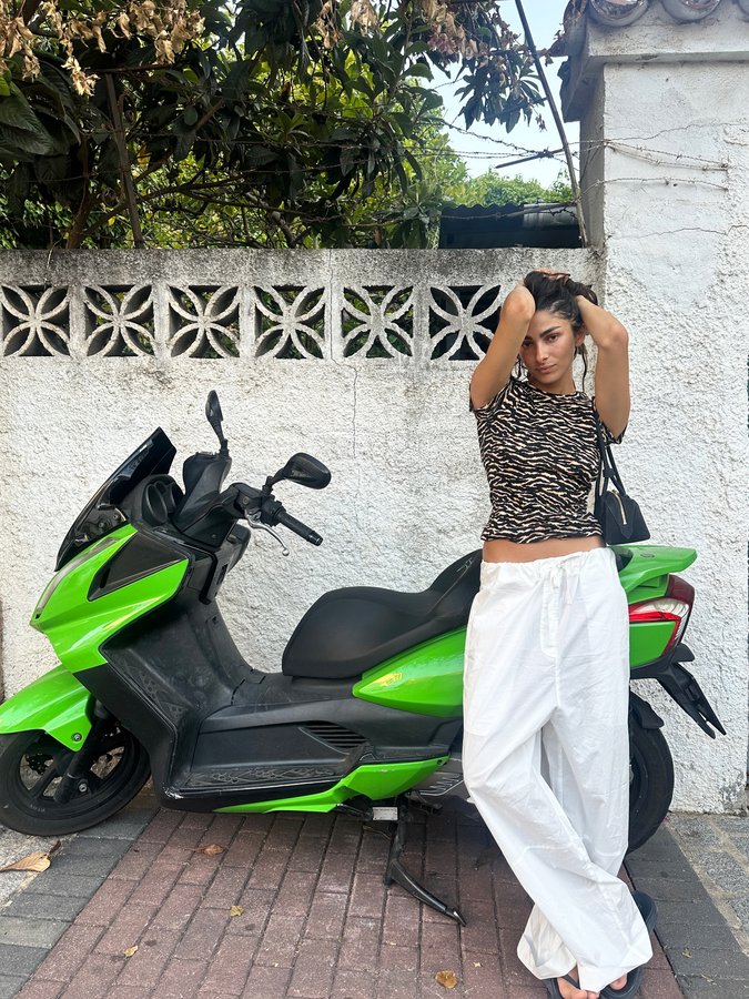 Instagram post by @skyeajones for Frankies Bikinis. Caption reads: 🔫💧💧💧🍉🌞🍊 @frankiesbikinis #frankiespartner....