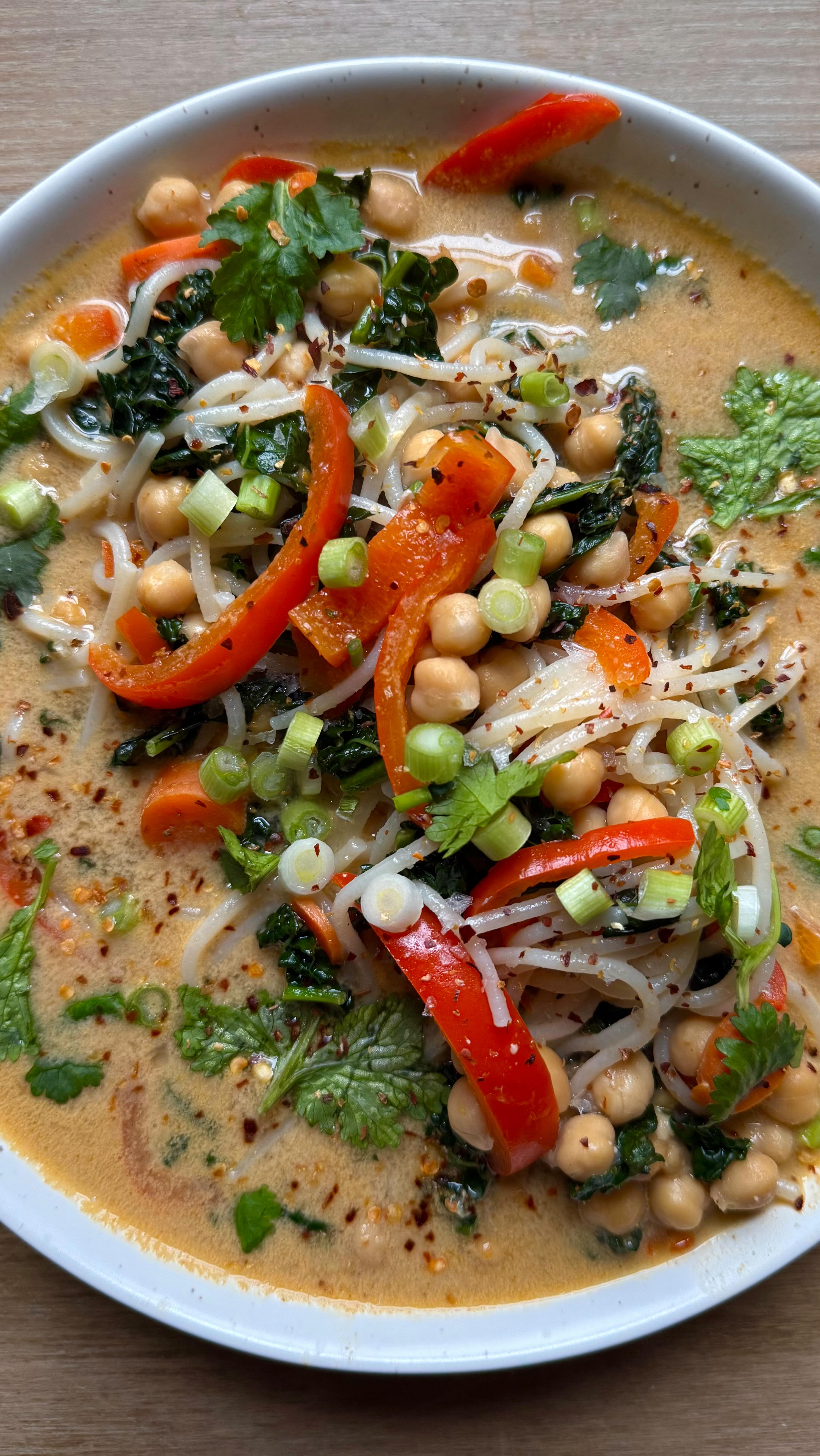 Instagram post by @glowwithella for Califia Farms. Caption reads: Coconut Curry Noodle Soup 🍜 

Made using my....