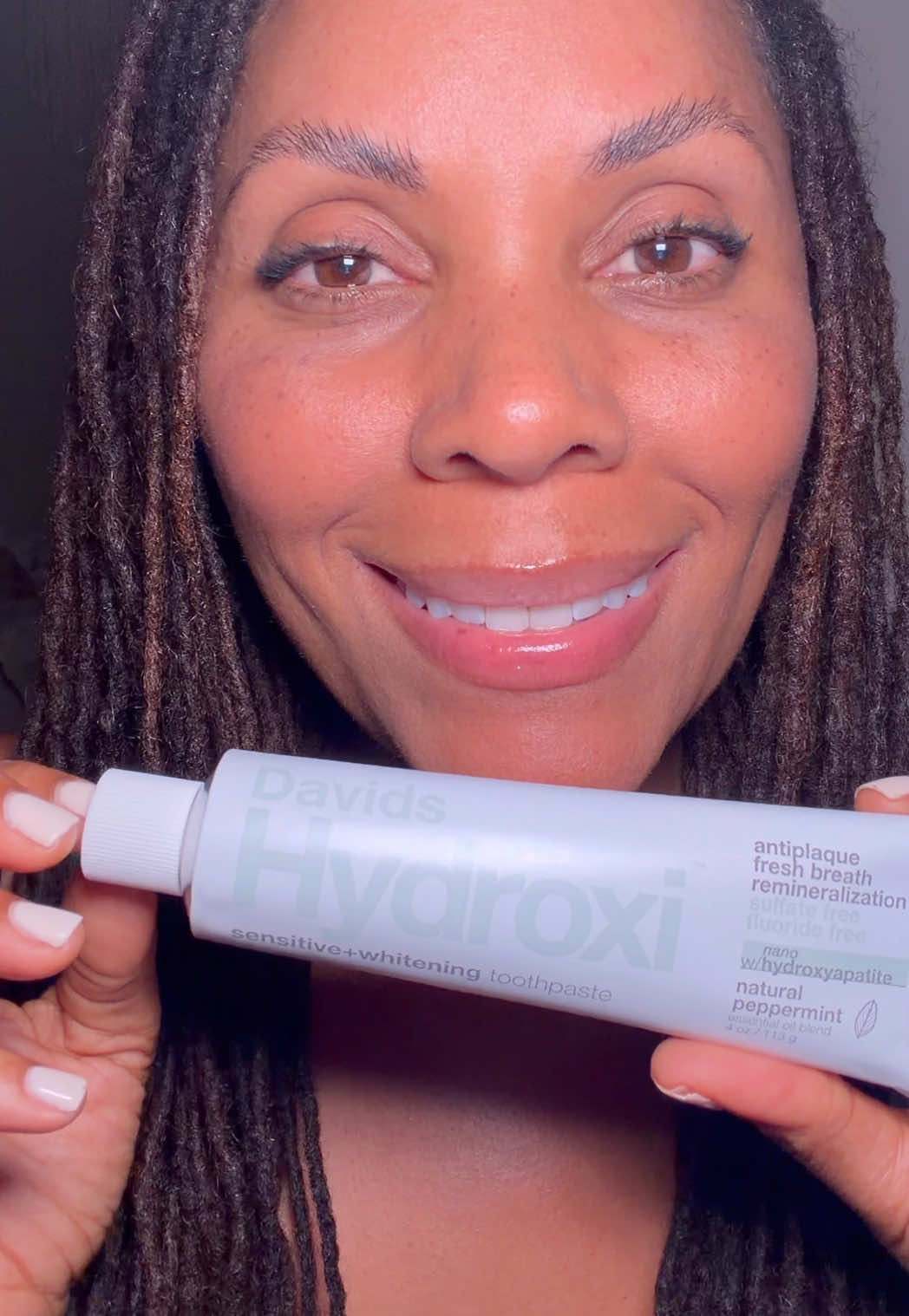 TikTok post by @beachbumwisdom for Davids Natural Toothpaste. Caption reads: @Davids Premium Oral Care is my go-to toothpaste....