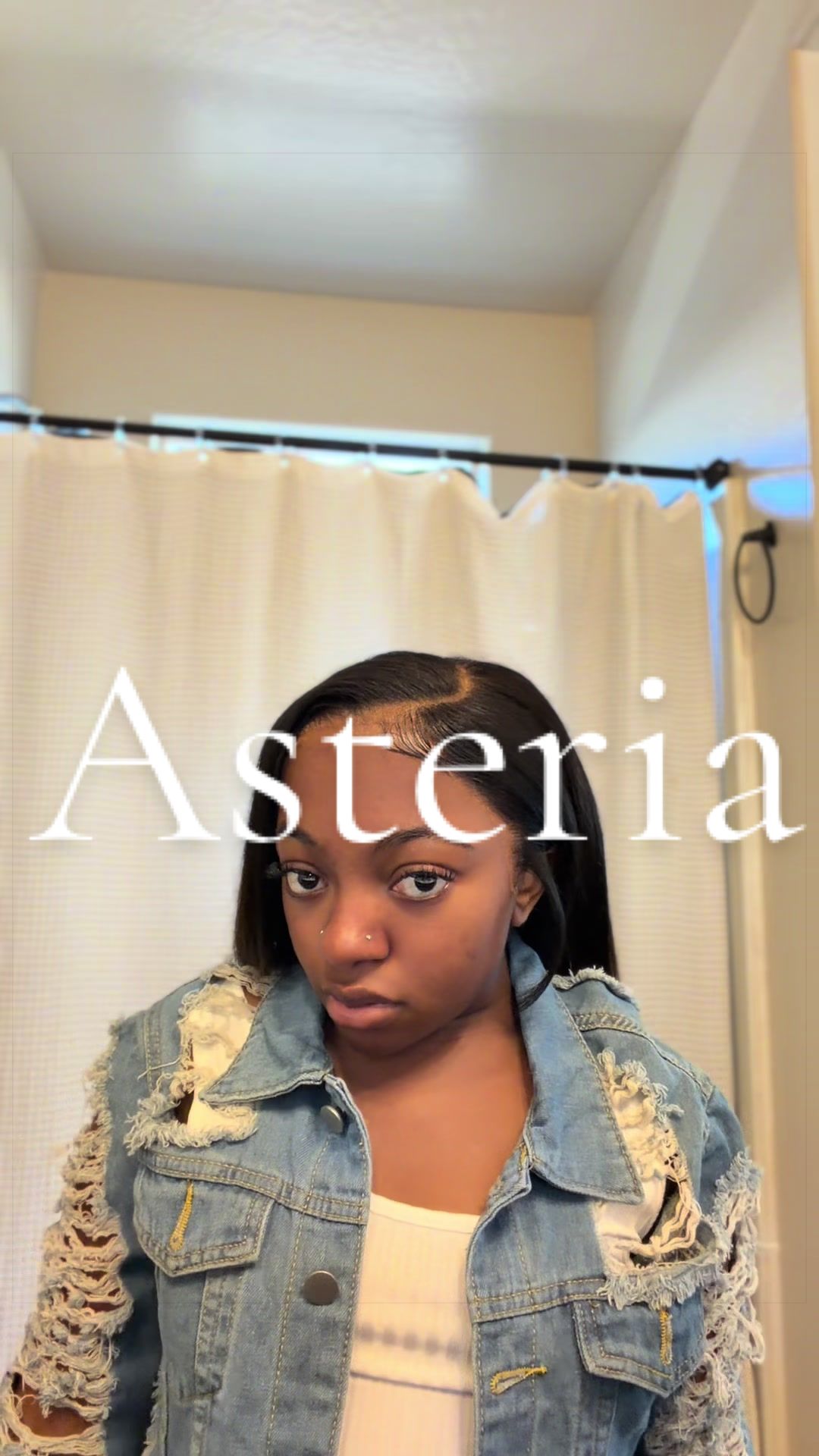 TikTok post by @mama_loux2 for Asteria Hair. Caption reads: She’s so bomb Wig from @Asteria Hair....