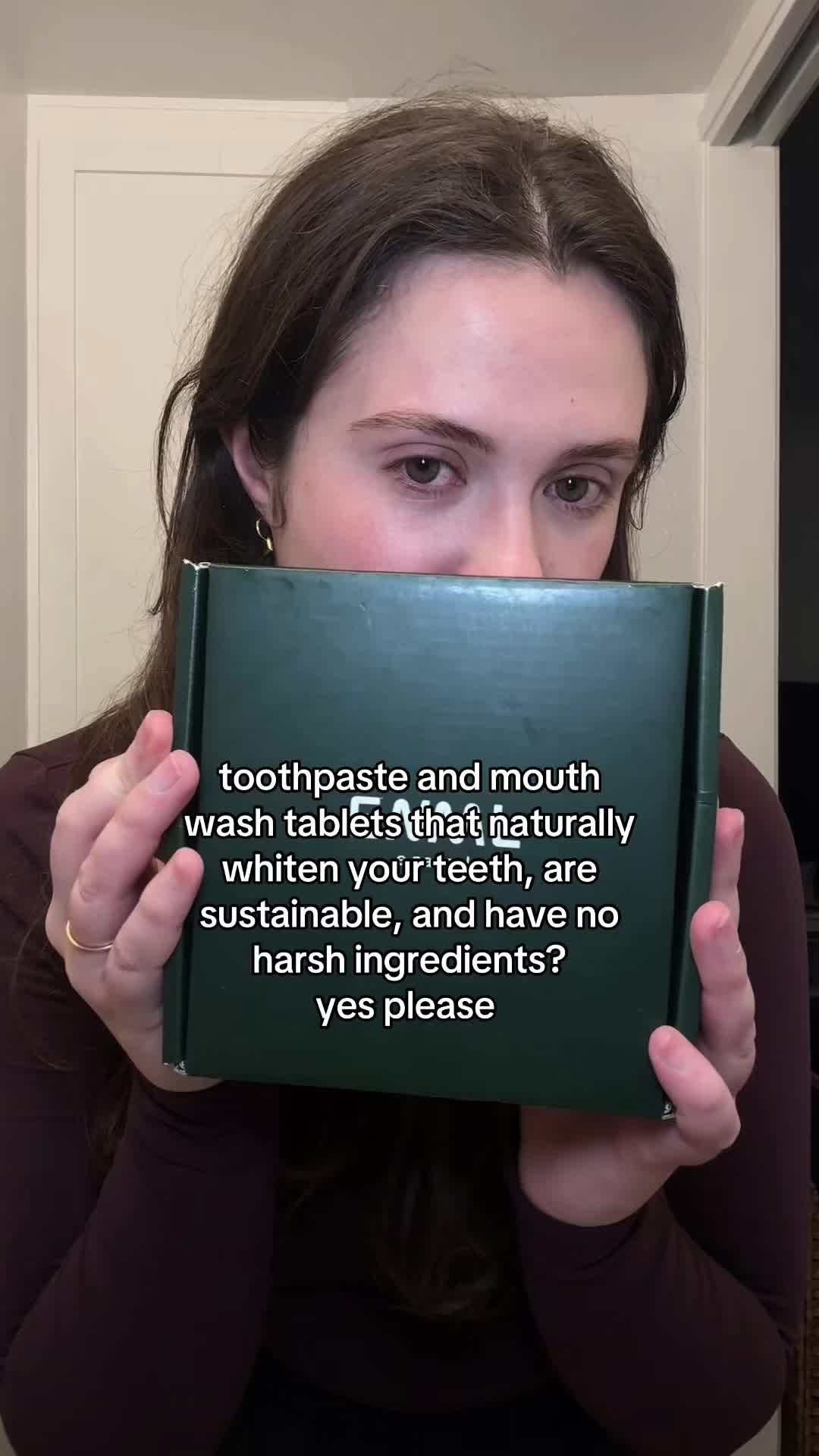 TikTok post by @evaluciacurci for ENML Toothpaste Tabs. Caption reads: @ENML Toothpaste Tabs #toothpastetablets....