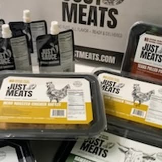 Instagram post by @usbngerol for Just Meats. Caption reads: Indulge in expertly cooked and perfectly seasoned....