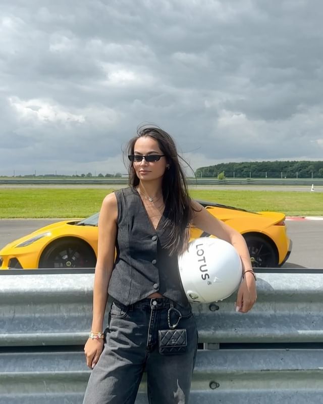 Instagram post by an influencer for Lotus Cars. Caption reads: racing cat 🔓🏎️❤️‍🔥 @lotuscars #LotusEmira....