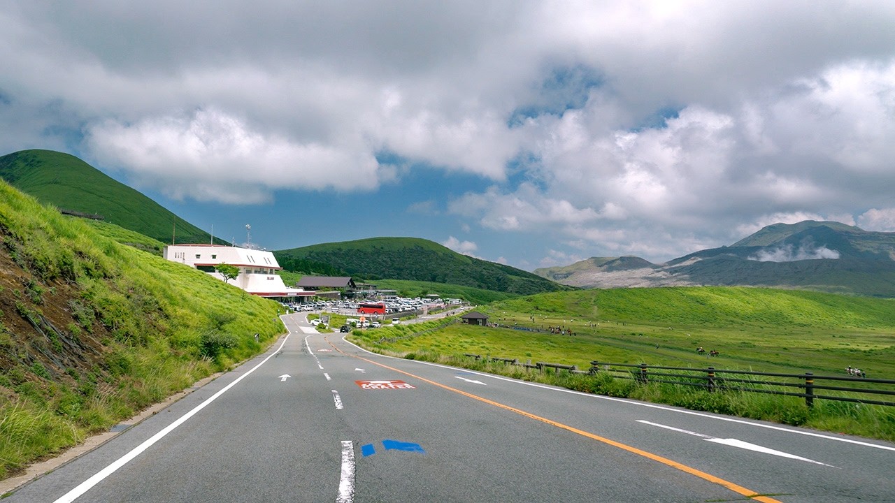 YouTube post by @DashcamRoadshow for Dehancer. Caption reads: Japan Scenic Drive 4K | Kumamoto City to Mt. Aso....