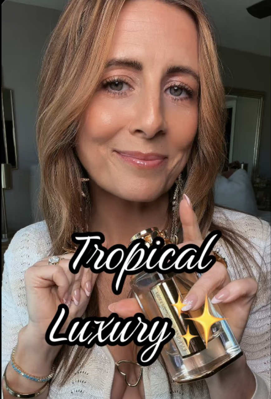 TikTok post by @xoroscents for Afnan Perfumes. Caption reads: [...] #luxurylife #summerscent @Afnan Perfumes USA.