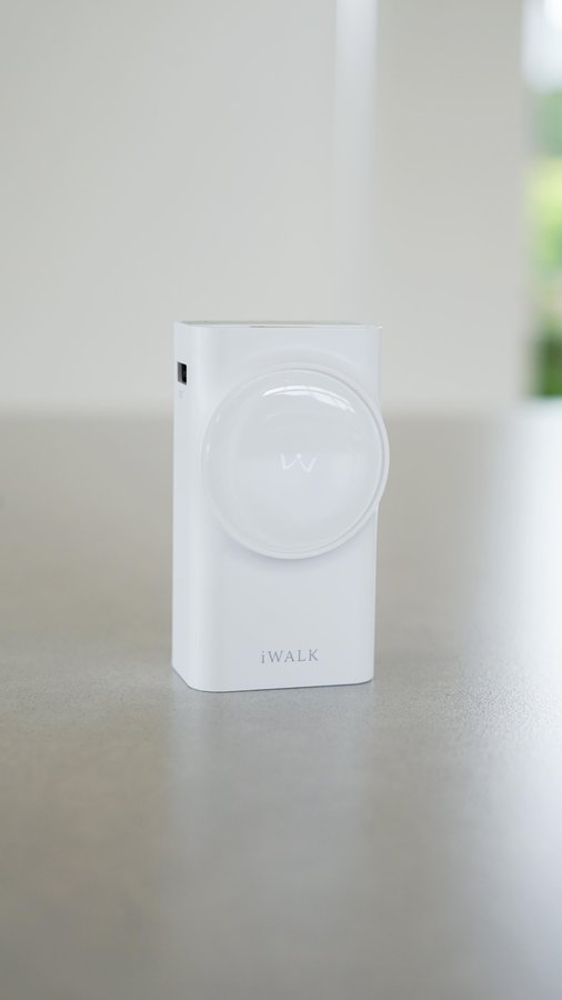 Instagram post by @denizbbts for iWALK. Caption reads: This iWALK Portable Charger has seriously made my....