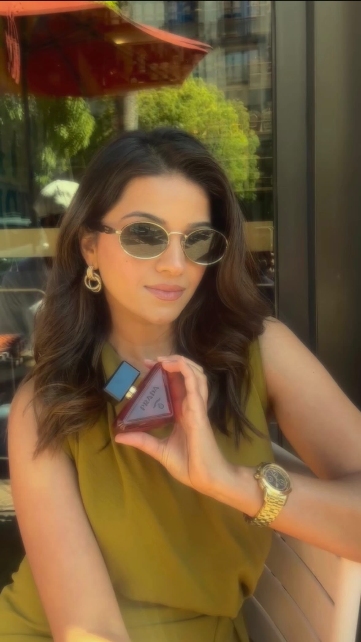 Instagram post by an influencer for Prada Beauty. Caption reads: [...] Radical Essence Parfum by @pradabeauty is....