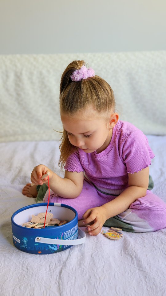 Instagram post by @kenzsay_through_the_lenz for Montessori Generation. Caption reads: Play and learn, all in one toy! Check out....