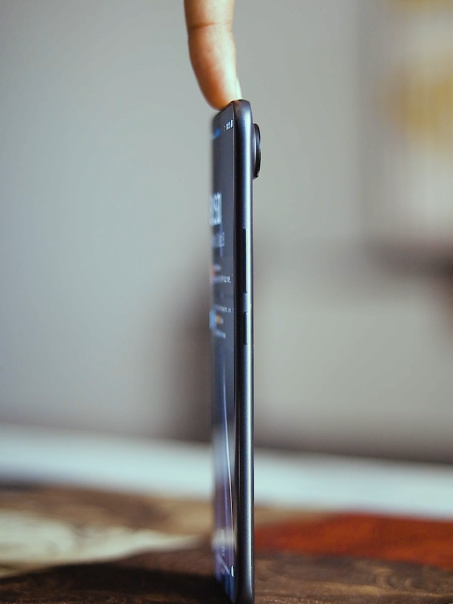 TikTok post by @1take_prod for Tecnomobile. Caption reads: paper thin ! #PowerYourMoment  #TECNOAFCON2025 ....