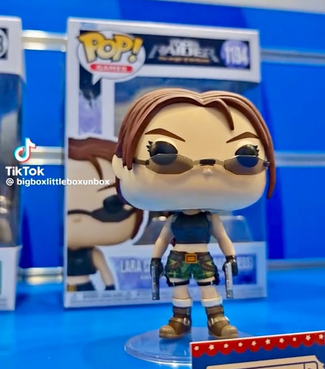Instagram post by @funkopopsnews for Funko. Caption reads: In hand! With the new Lara Croft Funko POP!....
