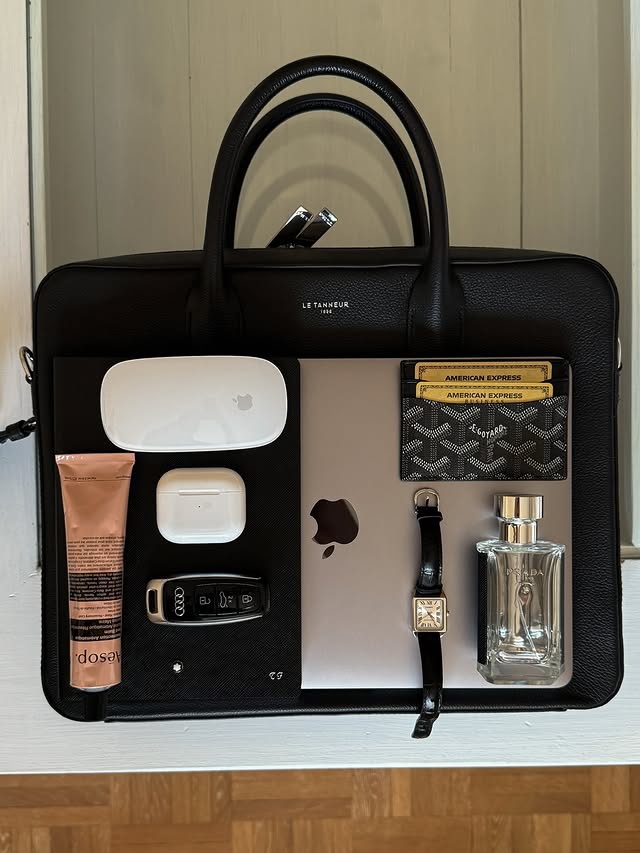 Instagram post by @tristanfruehwirth for Xerjoff. Caption reads: A day at work — inside the office bag of a luxury....