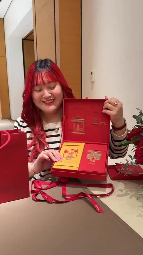 Instagram post by @trishtrinh for Cartier. Caption reads: Cartier Red Envelopes🧧❤️ @cartier ~ ~ ~ ~ ~ [...].