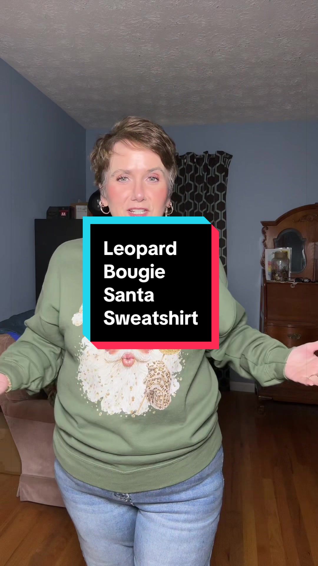 TikTok post by @gaylarnfromgeorgia for PoppyRose Print Company. Caption reads: [...] sweatshirt. #santasweatshirt....