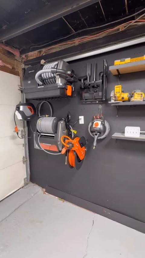 Instagram post by @avwooddesigns for Giraffe Tools. Caption reads: [...] retractable & organized garage with....