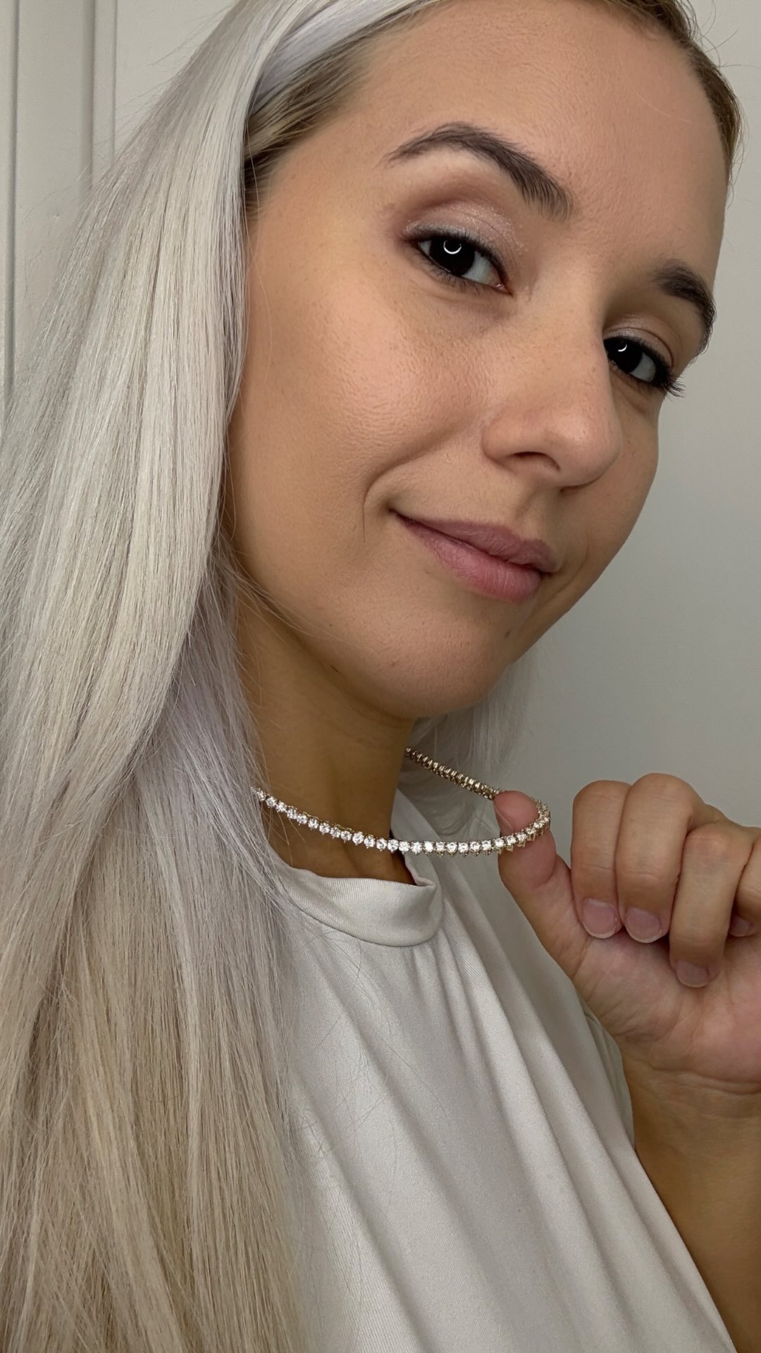 Instagram post by @carolinamunhoz for Melinda Maria. Caption reads: I LOVE a tennis necklace! But all of mine were....