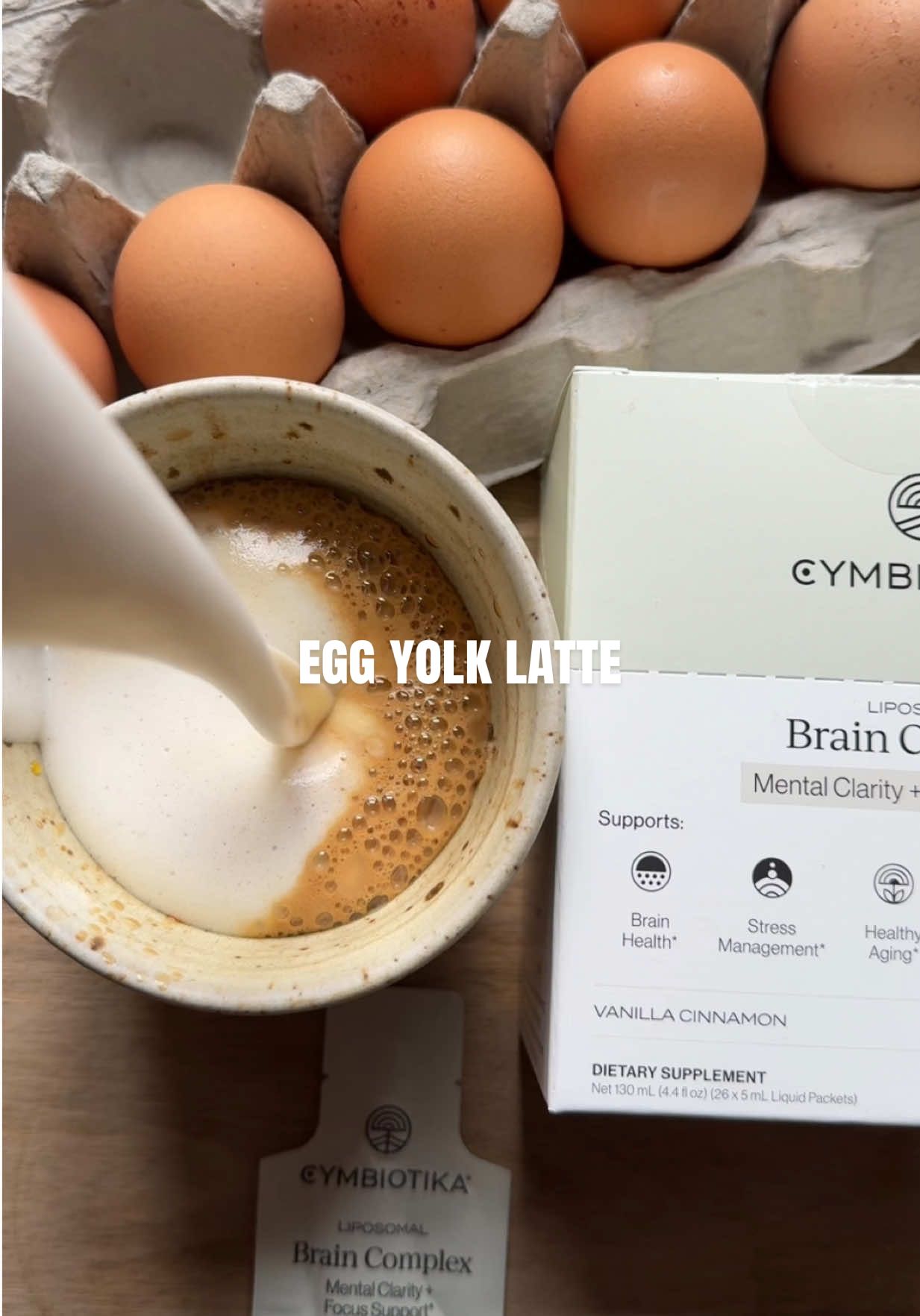 TikTok post by @glowwithella for Cymbiotika. Caption reads: [...] Brain Health Latte ☕️ Made with @Cymbiotika....